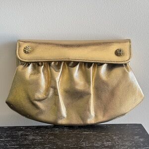 Vintage gold lame clutch purse with comb and mirror.
